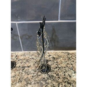 Large silver colored earrings‎